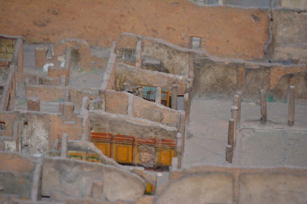 VI.11.9/10 Pompeii. July 2017. 
Looking towards north portico of peristyle 36, with east walls of rooms 39, just visible, 40, (yellow painted, in centre), 42, 43 (Corinthian oecus) and 46, visible on left.
From cork model in Naples Archaeological Museum.
Foto Annette Haug, ERC Grant 681269 DÉCOR.
