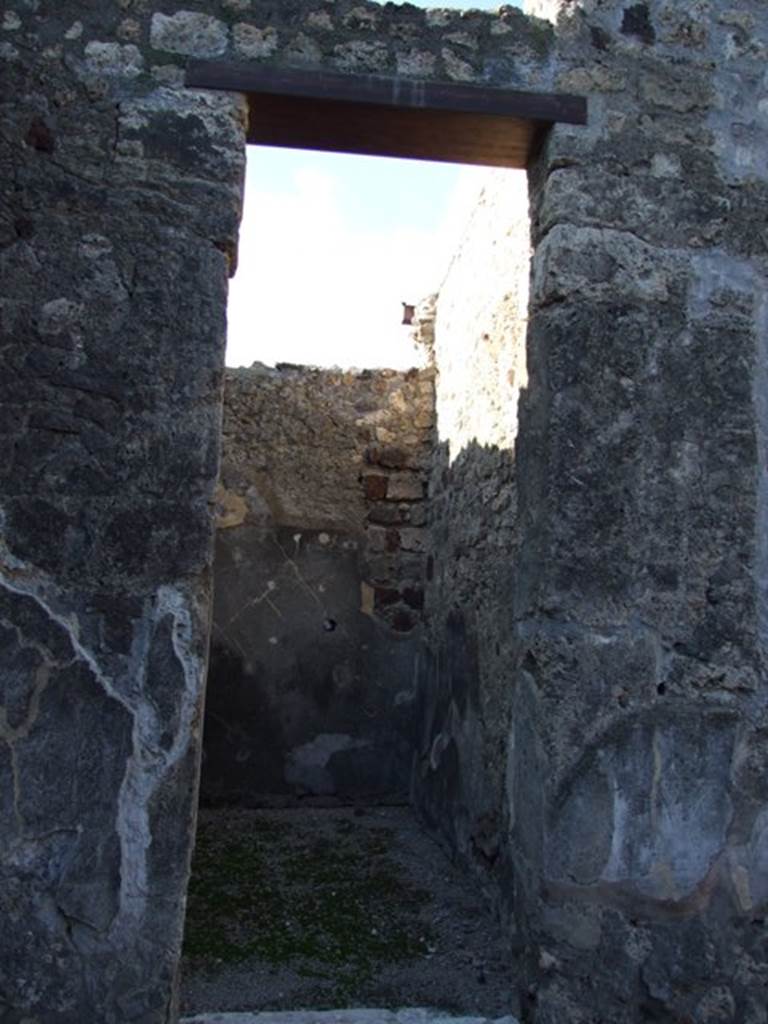 VI.11.10 Pompeii. December 2007. 
Doorway to room 28, looking towards north-west corner and along north wall.