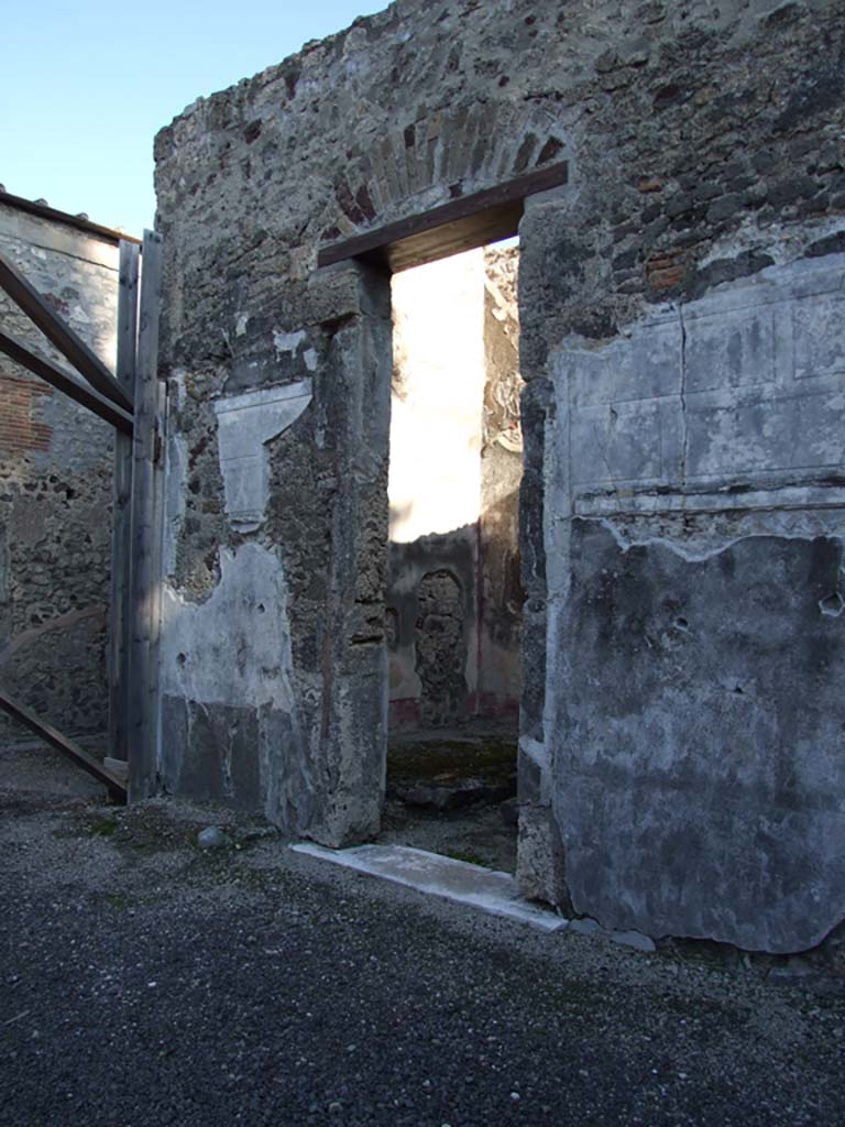 VI.11.10 Pompeii. December 2007. 
Looking north along east side of atrium with doorway to room 30, in centre.