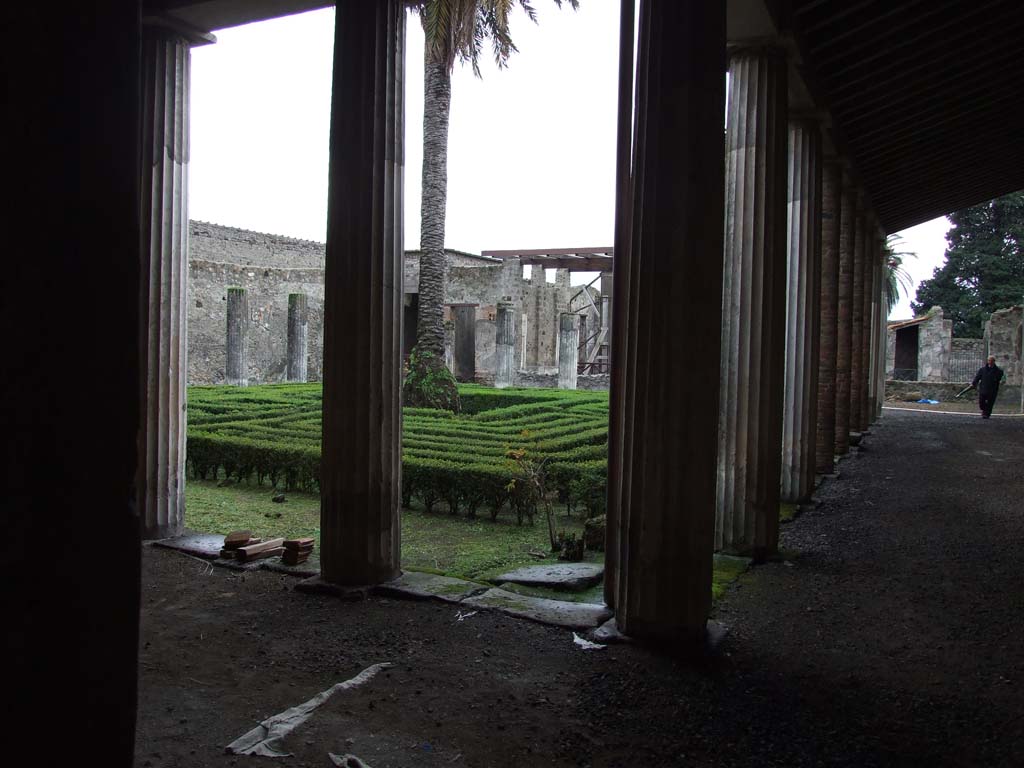 VI.11.10 Pompeii. December 2006. Looking across peristyle garden 36, from the north-west corner.
According to Jashemski, the large peristyle garden was enclosed by a portico on all sides.
The portico was supported by thirty stuccoed columns, on which numerous graffiti were written. 
This peristyle was one of the largest in the city, so far found.
The portico was four metres wide.
The skeleton of a woman was found in the garden at a height of about 2.50m above the original soil level. 
She had been fleeing with her jewels when she had been overcome by the falling of the lapilli. 
See Jashemski, W. F., 1993. The Gardens of Pompeii, Volume II: Appendices. New York: Caratzas. (p.143).
