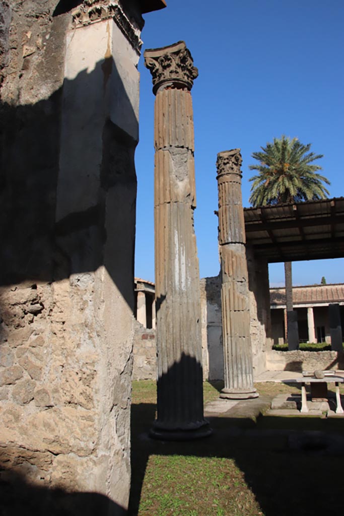 VI.11.10 Pompeii. October 2023. 
Looking towards columns on west side of impluvium. Photo courtesy of Klaus Heese.