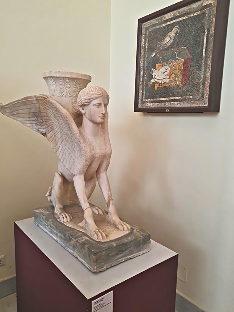 VI.12.2 Pompeii. September 2024.
Marble table support in the form of a sphinx, found between the columns in the second peristyle on 1st July 1831. 
Now in Naples Archaeological Museum. Inventory number 6869. Photo courtesy of Giuseppe Ciaramella.