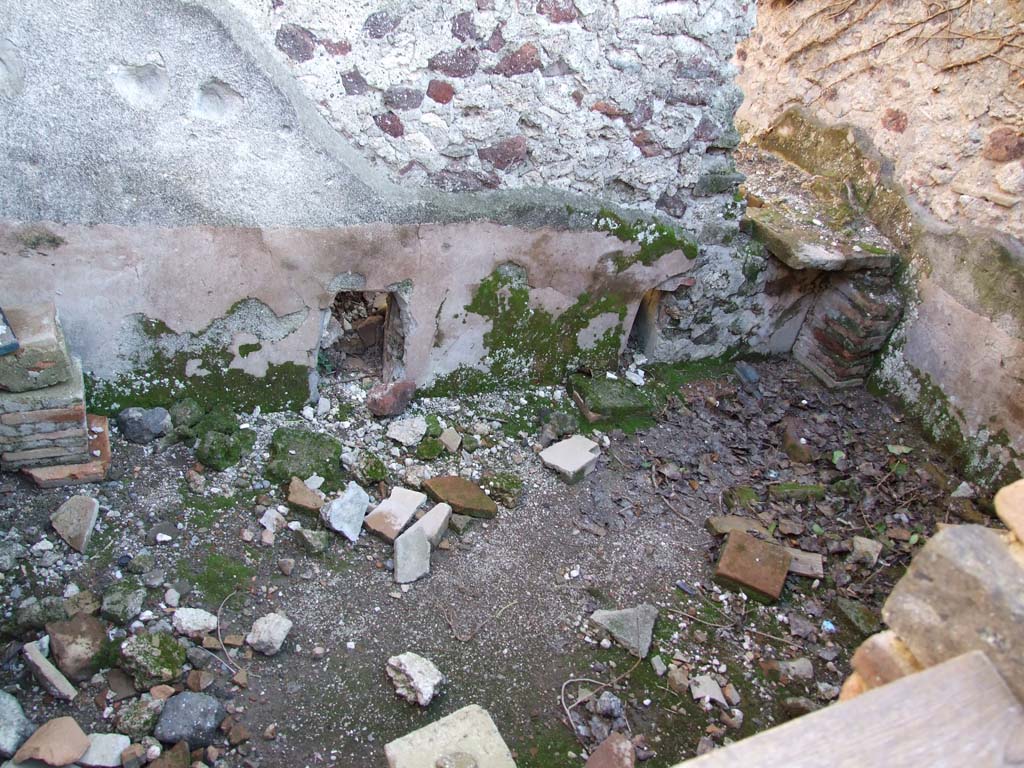 VI.12.2 Pompeii. December 2006. 
Second room at north end of corridor on east side, part of bath suite with remains of hypocaust.
(PPM – room 22/23)
