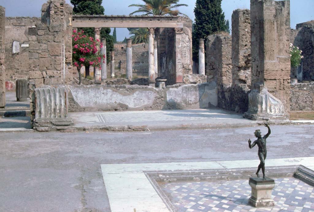 VI.12.2 Pompeii, August 1976. 
Looking north from impluvium in atrium, through tablinum across middle/first peristyle towards exedra and rear/second peristyle.
Photo courtesy of Rick Bauer, from Dr George Fay’s slides collection.