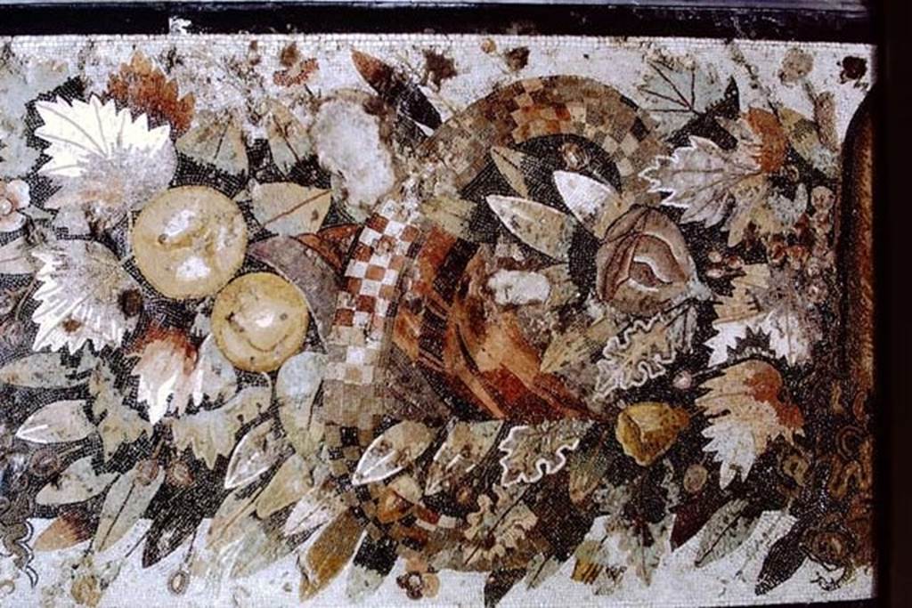 VI.12.2 Pompeii. 1968. Detail from centre of mosaic of fruits, flowers and garlands and two tragic masks.  
Photo by Stanley A. Jashemski.
Source: The Wilhelmina and Stanley A. Jashemski archive in the University of Maryland Library, Special Collections (See collection page) and made available under the Creative Commons Attribution-Non Commercial License v.4. See Licence and use details.
J68f1037