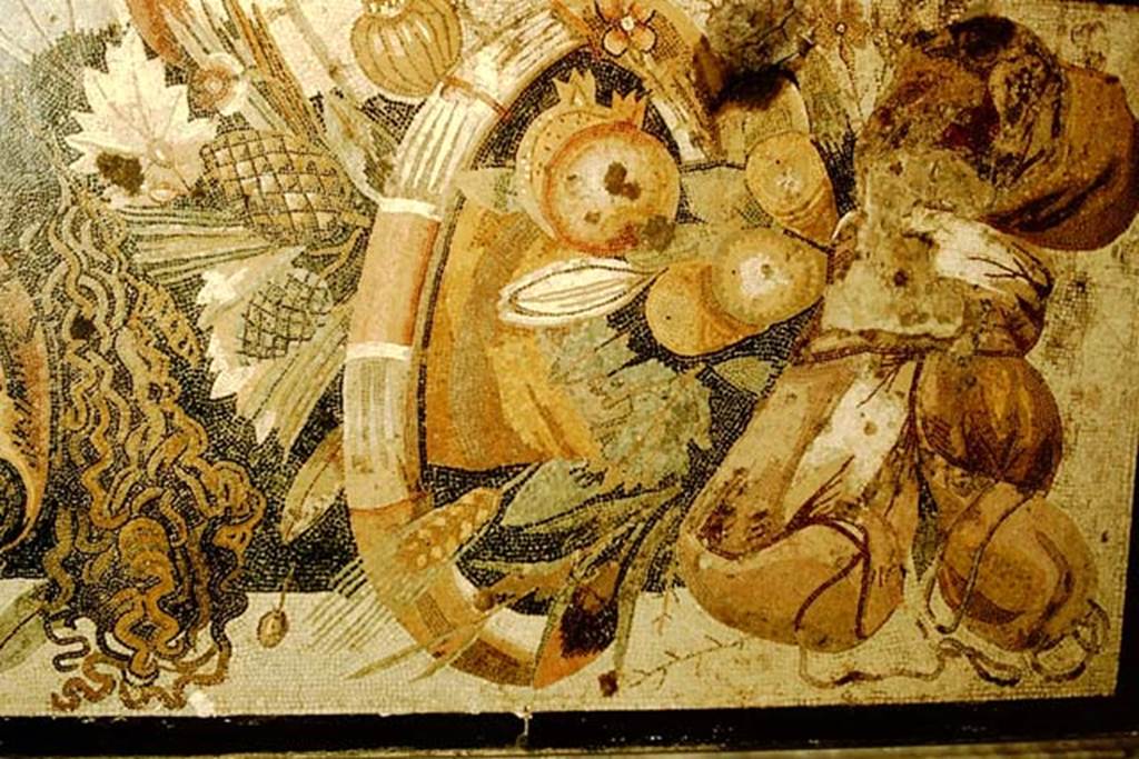 VI.12.2 Pompeii. 1957. Detail of fruits, flowers and garland from mosaic with two tragic masks.  Photo by Stanley A. Jashemski.
Source: The Wilhelmina and Stanley A. Jashemski archive in the University of Maryland Library, Special Collections (See collection page) and made available under the Creative Commons Attribution-Non Commercial License v.4. See Licence and use details.
J57f0532