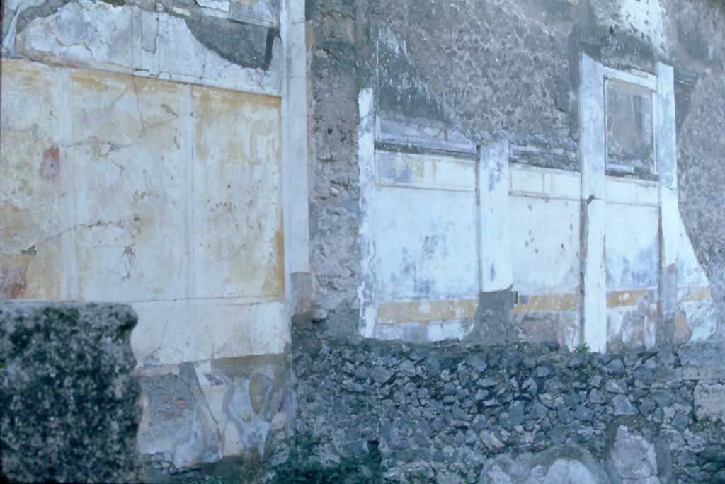VI.12.2 Pompeii. 4th December 1971. 
Looking towards west wall in north-west corner of triclinium/dining room 35 on west side of tablinum, on the left. 
On the right is the west wall in the south-west corner of the middle peristyle/garden.
Photo courtesy of Rick Bauer, from Dr George Fay’s slides collection.
