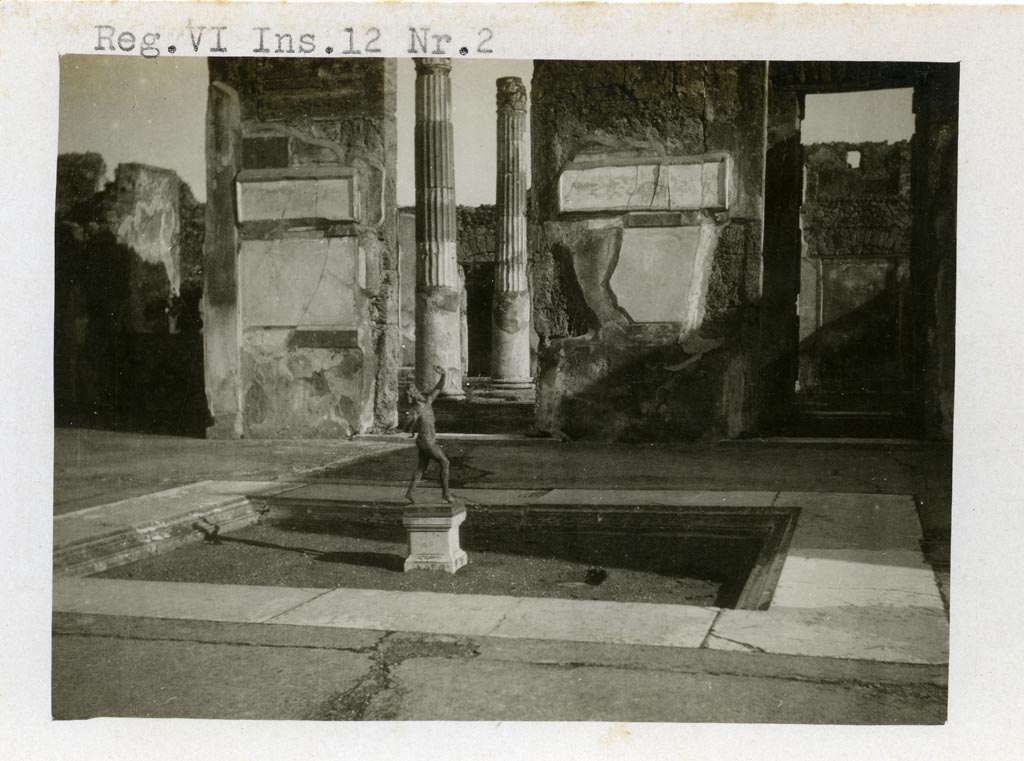 VI.12.2 Pompeii. pre-1937-39. 
Looking east across impluvium in atrium towards doorway to ala 11 into atrium of VI.12.5, in centre. 
On the right is the doorway to a cubiculum 10.
Photo courtesy of American Academy in Rome, Photographic Archive. Warsher collection no. 1416