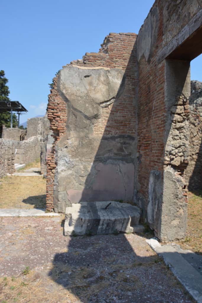 VI.12.5 Pompeii. 14th July 2017. North-east corner of Secondary Atrium, looking north.
Foto Annette Haug, ERC Grant 681269 DÉCOR.
According to Pernice, found in the north-eastern corner of the four-columned atrium was an iron-lined, chest.
Made from a single block of travertine and notched at the corners up to 18 cm deep. These notches were filled by the feet of the box, which were bent at right angles. 
This meant that the base and the box standing on it formed an inseparable unit. The iron pin that ran from the base through the box provided additional anchoring.
See Pernice, E., 1932. Hellenistische Tische, Zisternenmündungen, Beckenuntersätze, Altäre u. Truhen. Berlin, p. 72, Taf. 43.1.