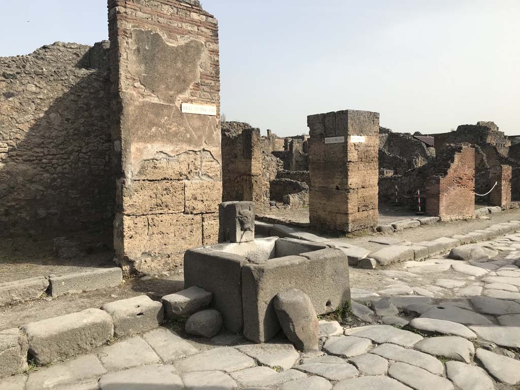 VI.13.7 Pompeii, on left. April 2019. Fountain outside VI.13.7 on north side of Via Della Fortuna.  
Photo courtesy of Rick Bauer.