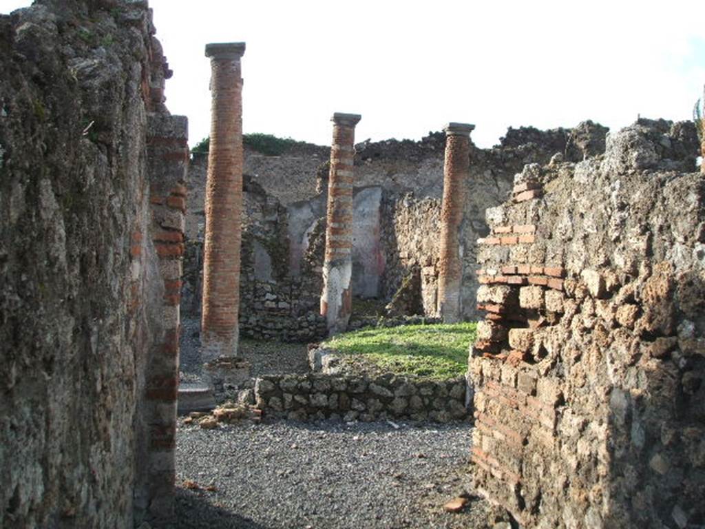 VI.13.9 Pompeii. December 2004. Looking west across peristyle, from rear entrance. According to Garcia y Garcia, in 1943 a bomb destroyed the rear entrance at VI.13.9. The three nearby rooms on the south-east side of the peristyle were destroyed as well as a good part of the east wall. See Garcia y Garcia, L., 2006. Danni di guerra a Pompei. Rome: L’Erma di Bretschneider. (p.86-87)
According to Jashemski, numerous graffiti found indicated that the peristyle had been converted into a spinning and weaving establishment. See VI.13.8 for the graffiti. This area was badly damaged by the 1943 bombing.
See Jashemski, W. F., 1993. The Gardens of Pompeii, Volume II: Appendices. New York: Caratzas. (p.147)