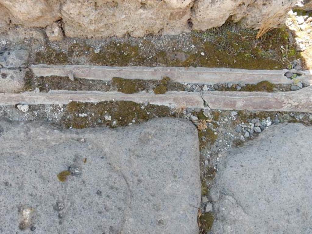 VI.13.13 Pompeii. May 2015. Detail of lead pipes in Vicolo dei Vettii. Photo courtesy of Buzz Ferebee.
