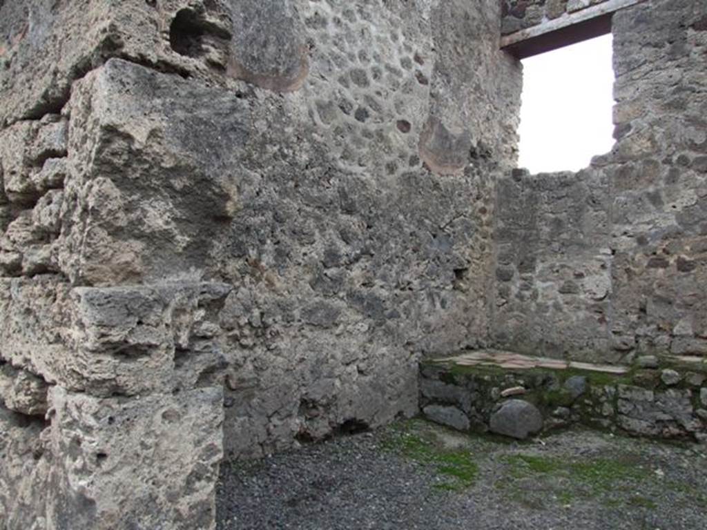 VI.13.14 Pompeii. December 2007. South wall and south-west corner with possible steps to upper floor in front of blocked door.