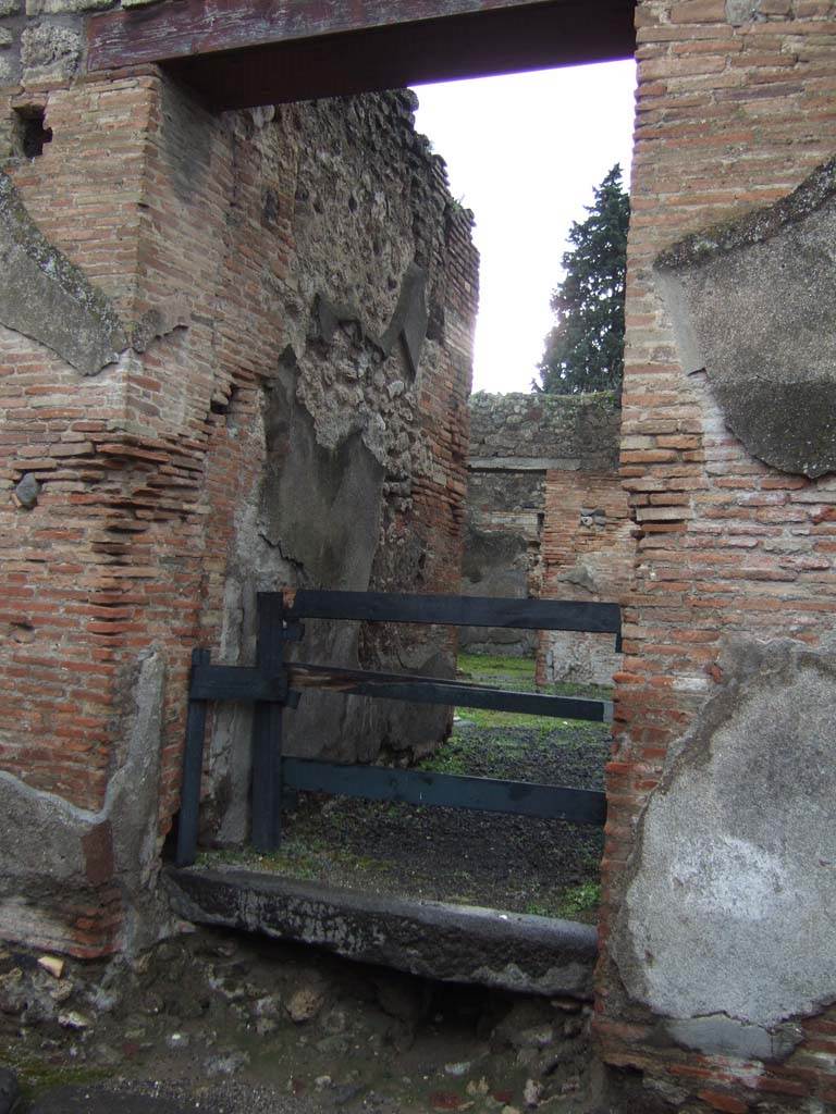 VI.13.16 Pompeii. December 2005. Entrance doorway, looking west. 
This small dwelling also had a second doorway on the west façade of the insula.
On both sides of the doorway (at VI.13.16) were painted dipinti of electoral recommendations, very frequent at Pompeii, and here we give an example –