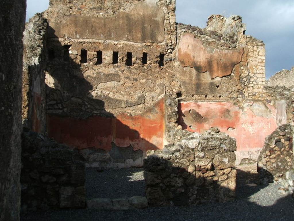 VI.14.8 Pompeii. December 2004. Doorways to two rear rooms. According to Eschebach, on the left was a triclinium, on the right was a small room with stairs to upper floor. See Eschebach, L., 1993. Gebäudeverzeichnis und Stadtplan der antiken Stadt Pompeji. Köln: Böhlau. (p.209)