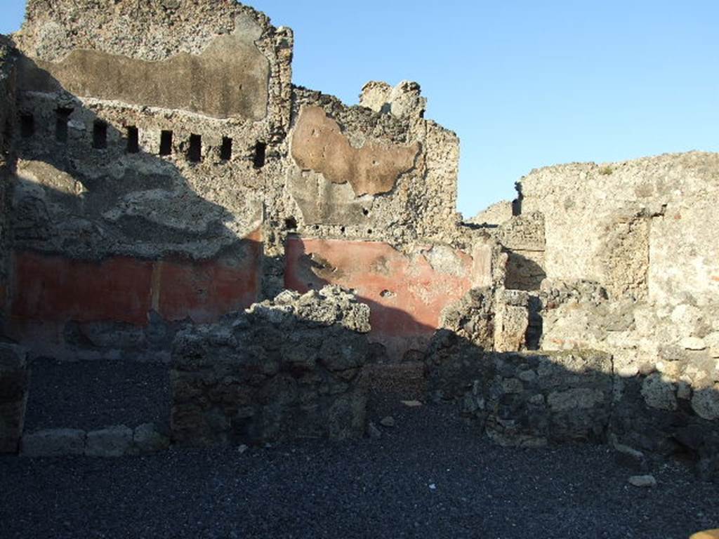 VI.14.8 Pompeii. December 2006. Doorway to small room on right side, with stairs to upper floor ? According to Helbig, visible in the second rear room on the left was an unclear painting. See Helbig, W., 1868. Wandgemälde der vom Vesuv verschütteten Städte Campaniens. Leipzig: Breitkopf und Härtel. (1387b).  According to Fiorelli, the painting perhaps showed two litigants in the presence of a magistrate? See Pappalardo, U., 2001. La Descrizione di Pompei per Giuseppe Fiorelli (1875). Napoli: Massa Editore. (p.157).  According to Eschebach, this may also have been known as the “Casetta dei Litiganti”, presumably named from the painting.  See Eschebach, L., 1993. Gebäudeverzeichnis und Stadtplan der antiken Stadt Pompeji. Köln: Böhlau. (p.209)