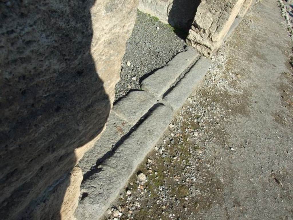 VI.14.13 Pompeii. December 2007. Threshold or sill at front of shop for wooden shutters.