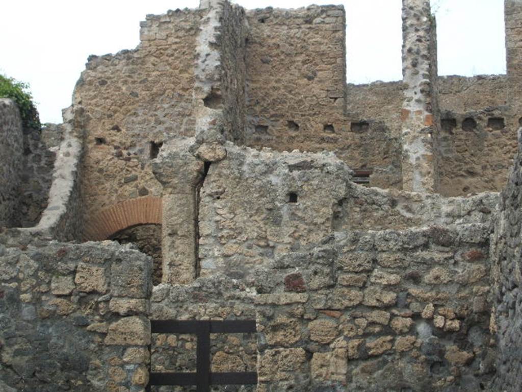 VI.14.15 Pompeii. May 2005. North wall with doorway to rear room.