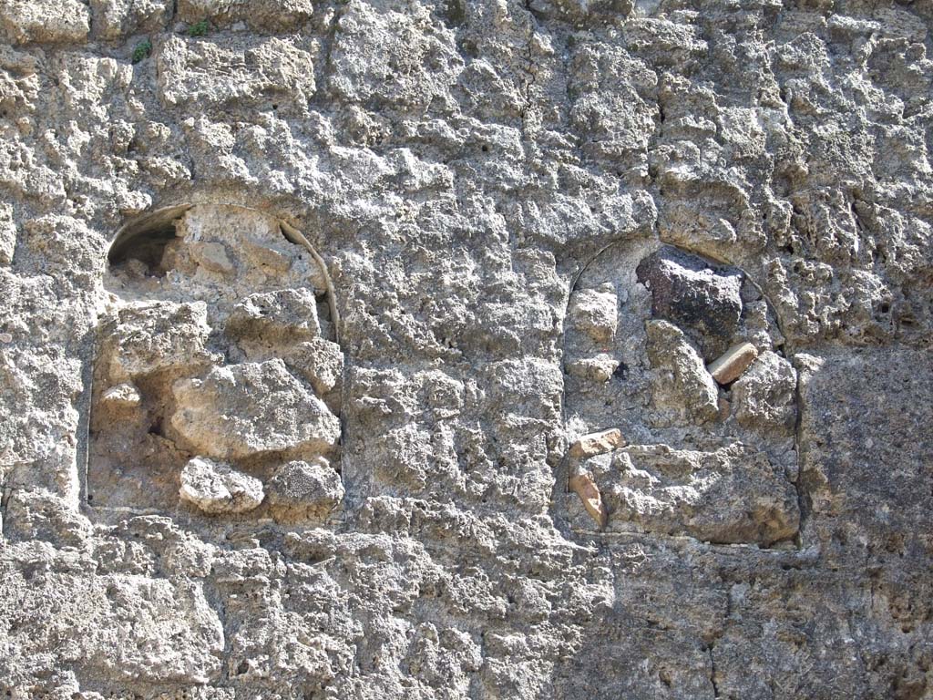 VI.14.20 Pompeii. March 2009. Room 10, 2 niches (filled in) on upper east wall of triclinium.