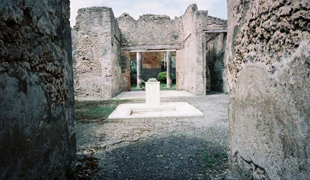 VI.14.20 Pompeii. May 2000. Looking west across atrium 1 towards tablinum 4.
Photo courtesy of Buzz Ferebee.