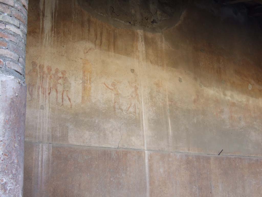 VI.14.22 Pompeii. December 2007. Room 12, south wall of raised level. 
Wall paintings of groups of figures. According to Seyffert, “the fullones at Rome formed one of the oldest guilds. 
Like all mechanics, they worshipped Minerva as their tutelary goddess, and took a prominent part in her chief festival, the Quinquatrus”. 
See Seyffert, Dr O., 1894, Dictionary of Classical Antiquities, London: William Glaisher. (p243-4).