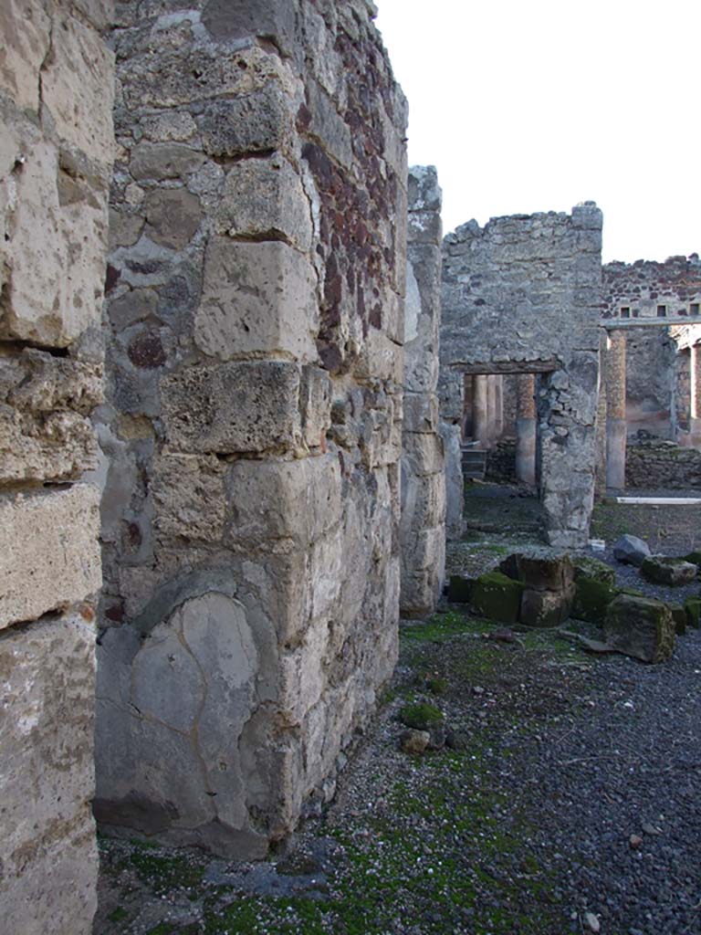 VI.14.22 Pompeii. December 2007. 
Room 1, looking west along south side of atrium, and doorways to rooms 2, 3 and 4.