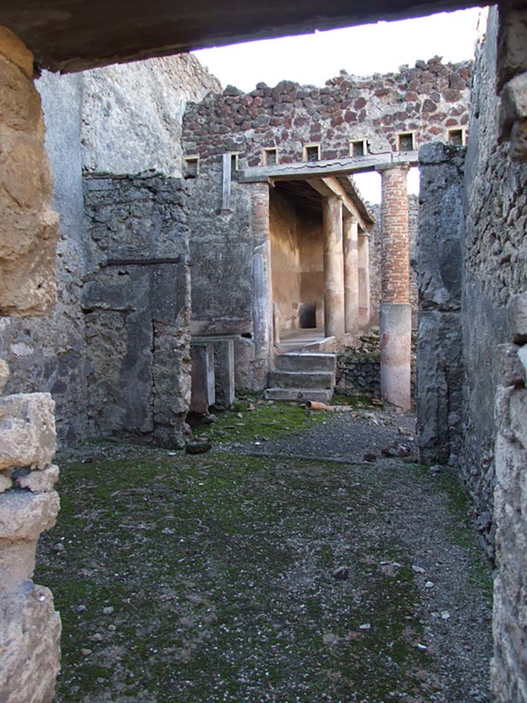 VI.14.22 Pompeii. December 2007. 
Room 5, looking west to peristyle which has been converted with vats for fulling.