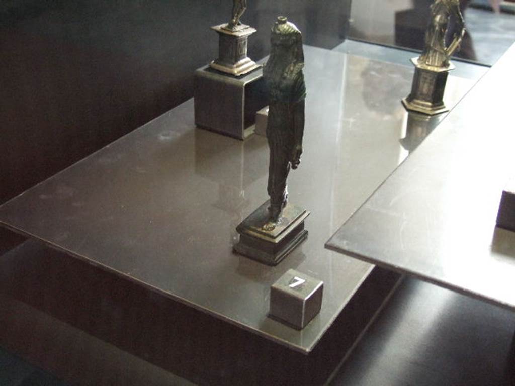 VI.14.27 Pompeii. Found in room “b”. Bronze statuette of Isis found in house.  
Now in Naples Archaeological Museum.