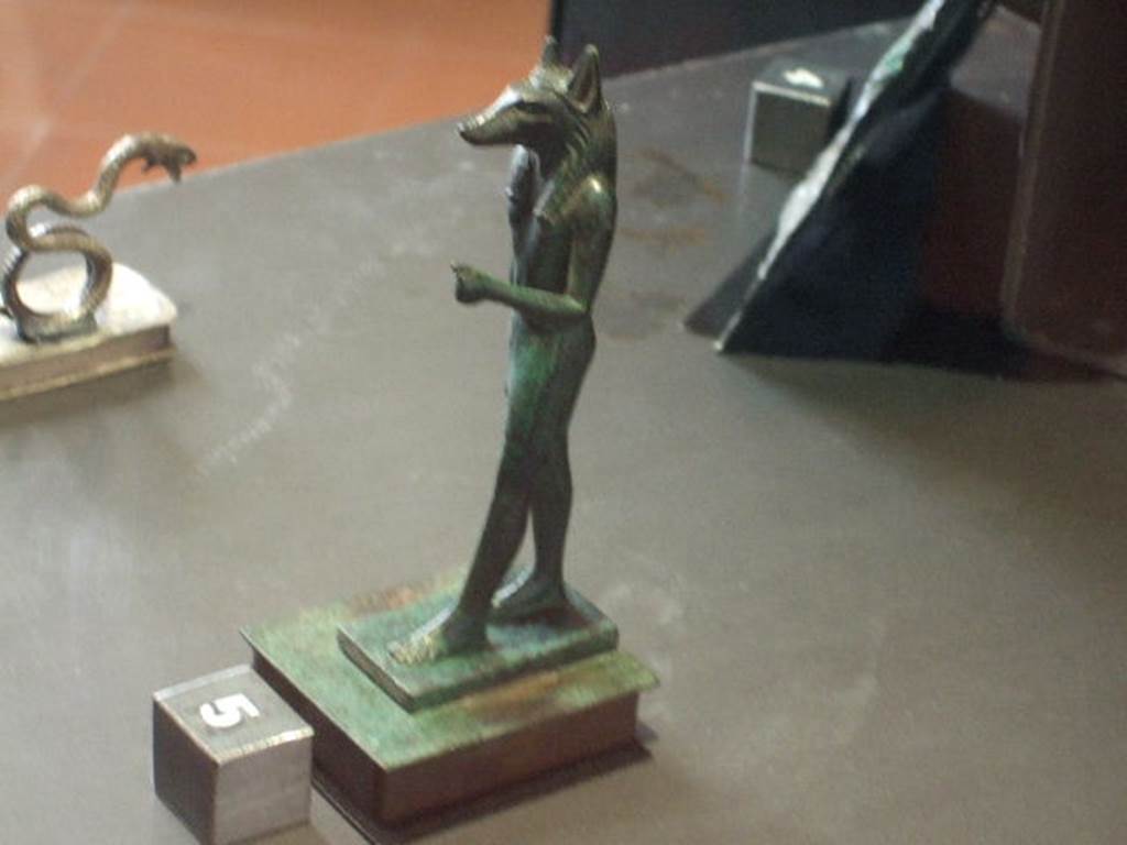 VI.14.27 Pompeii Found in room “b”, a bronze statuette of the dog faced Egyptian god Anubis.  
Now in Naples Archaeological Museum. Inventory number 110606.