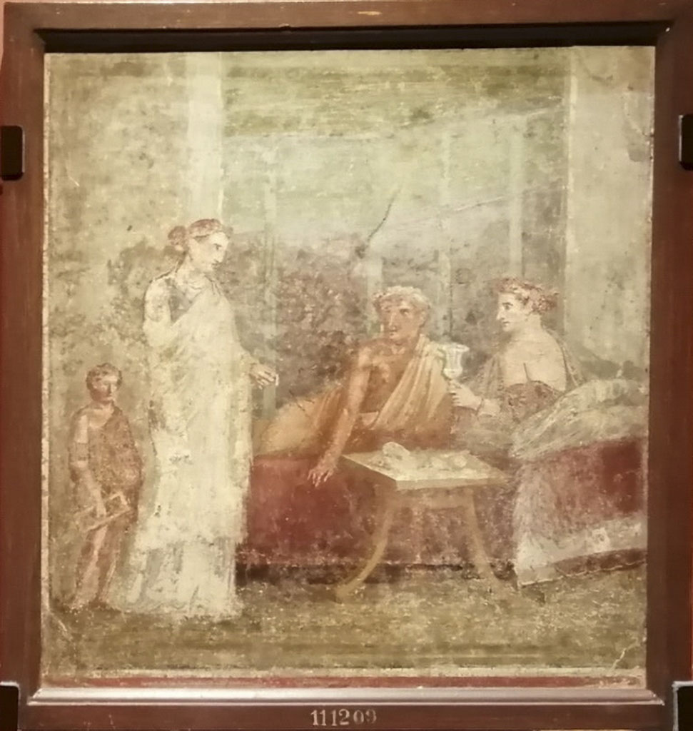 VI.14.29 Pompeii. Banqueting scene. Now in Naples Archaeological Museum. Inventory number 111209.
See Sogliano, A., 1879. Le pitture murali campane scoverte negli anni 1867-79. Napoli: (p. 131, no. 641)
See Ward Perkins, J. and Claridge A., 1976. Pompeii AD 79. London: Westerham. (cat. No.261, described as wall painting from a room beside the fauces)
See Richardson, L., 2000. A Catalog of Identifiable Figure Painters of Ancient Pompeii, Herculaneum. Baltimore: John Hopkins, (p.120, from VI.14.29/30, cubiculum d, south of fauces, The Bride of Corinth, NAP 111209)