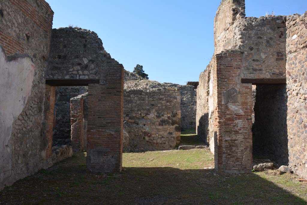 VI.14.30 Pompeii. October 2019. 
Looking west across atrium towards tablinum with doorway to corridor linking to VI.14.32 in its west wall.
Foto Annette Haug, ERC Grant 681269 DÉCOR.