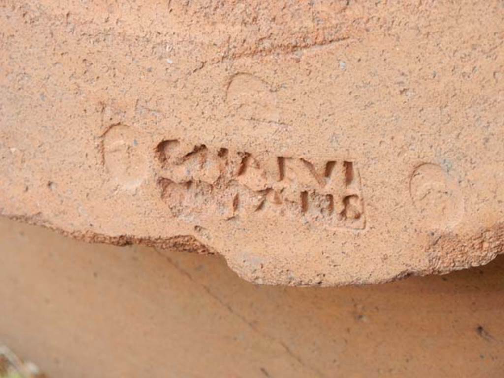 VI.14.35 Pompeii. May 2017. Detail of embossed stamp on large terracotta pot on east side of doorway.  Photo courtesy of Buzz Ferebee.