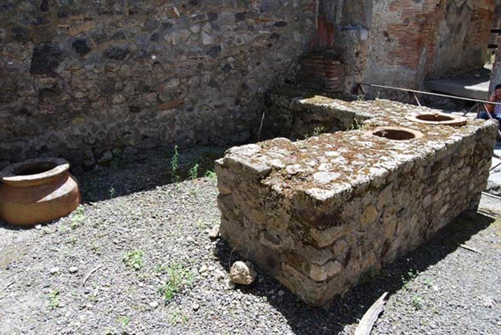 VI.14.36 Pompeii. May 2013. Looking south-west across counter towards shelves in corner.
Photo courtesy of Paula Lock.