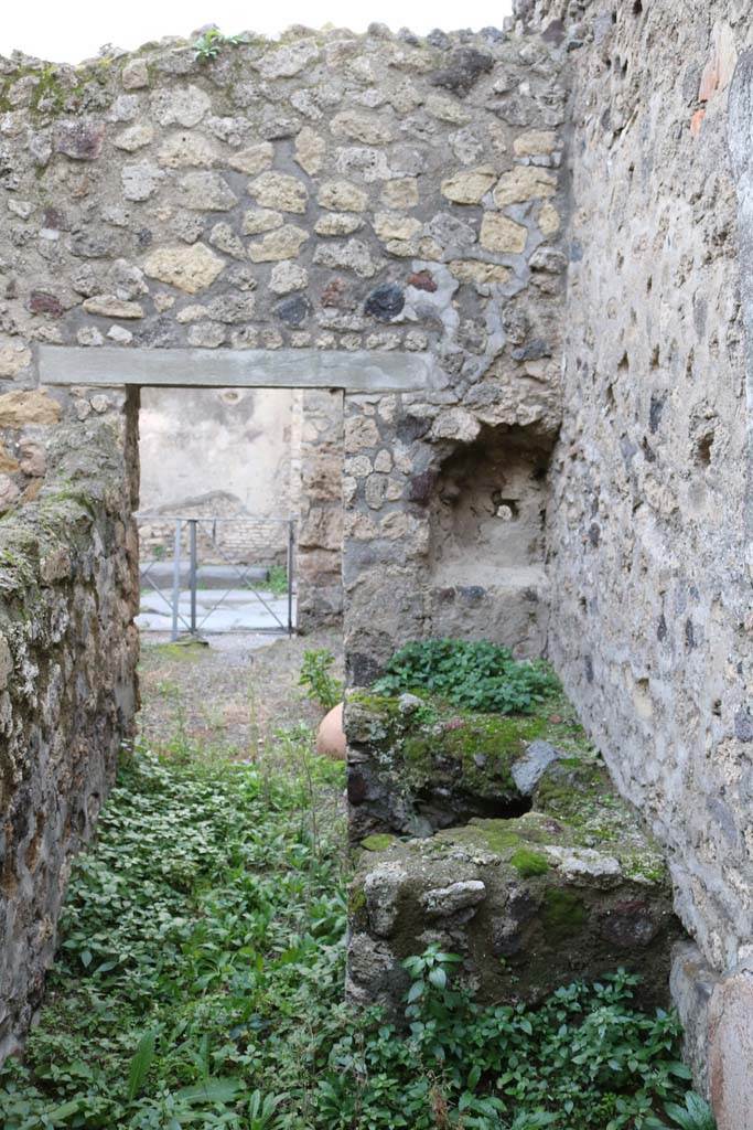 VI.14.36 Pompeii. December 2018. 
Hearth in north-west corner of kitchen. Photo courtesy of Aude Durand.