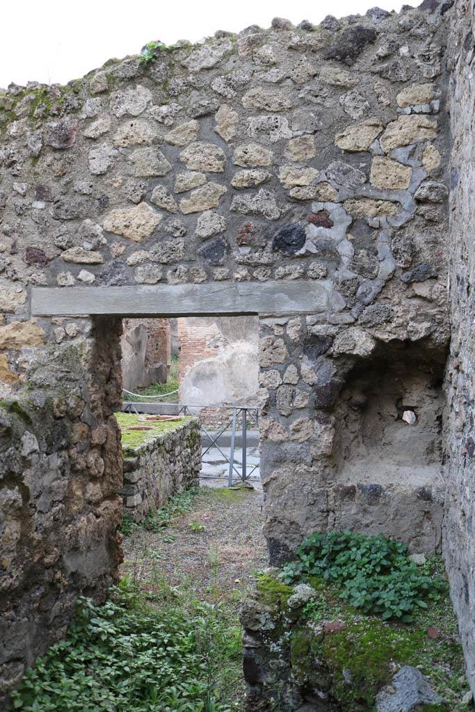 VI.14.36 Pompeii. December 2018. 
West wall of kitchen, with recess/niche above hearth in north-west corner. Photo courtesy of Aude Durand.