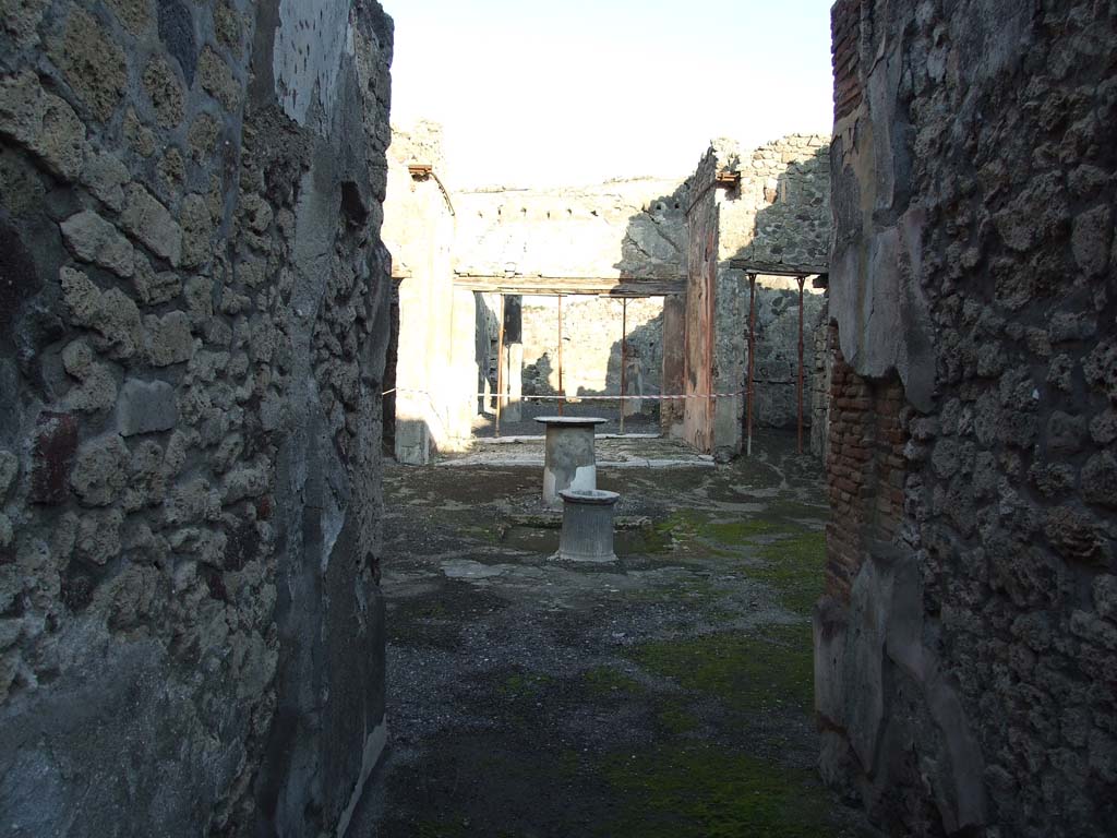 VI.14.40 Pompeii. December 2007. Looking east from fauces or entrance corridor, across atrium to tablinum.  
According to Garcia y Garcia, this house also had two rooms hit by the 1943 bombardment, with the loss of IV style painting.
See Garcia y Garcia, L., 2006. Danni di guerra a Pompei. Rome: L’Erma di Bretschneider. (p.93, with two photos by Tatiana Warscher pre 1943 on p.94).