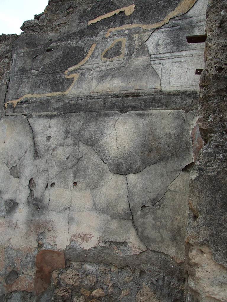 VI.14.43 Pompeii. December 2006. 
Remains of wall plaster on inside right-hand side of entrance vestibule.