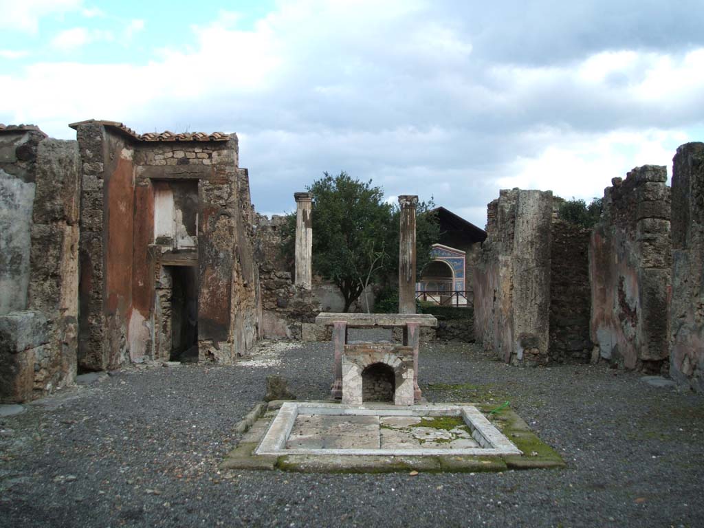 VI.14.43 Pompeii. December 2004. 
Room 1, looking east across atrium and tablinum, pseudoperistyle and mosaic fountain in background.