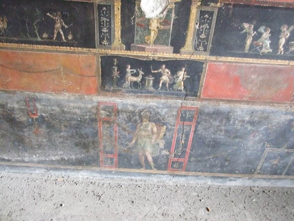 VI.15.1 Pompeii. December 2006. Room of the Cupids or Cherubs. East wall with painting of a stag being sacrificed to Diana. Underneath is a standing figure of an Amazon armed with shield.