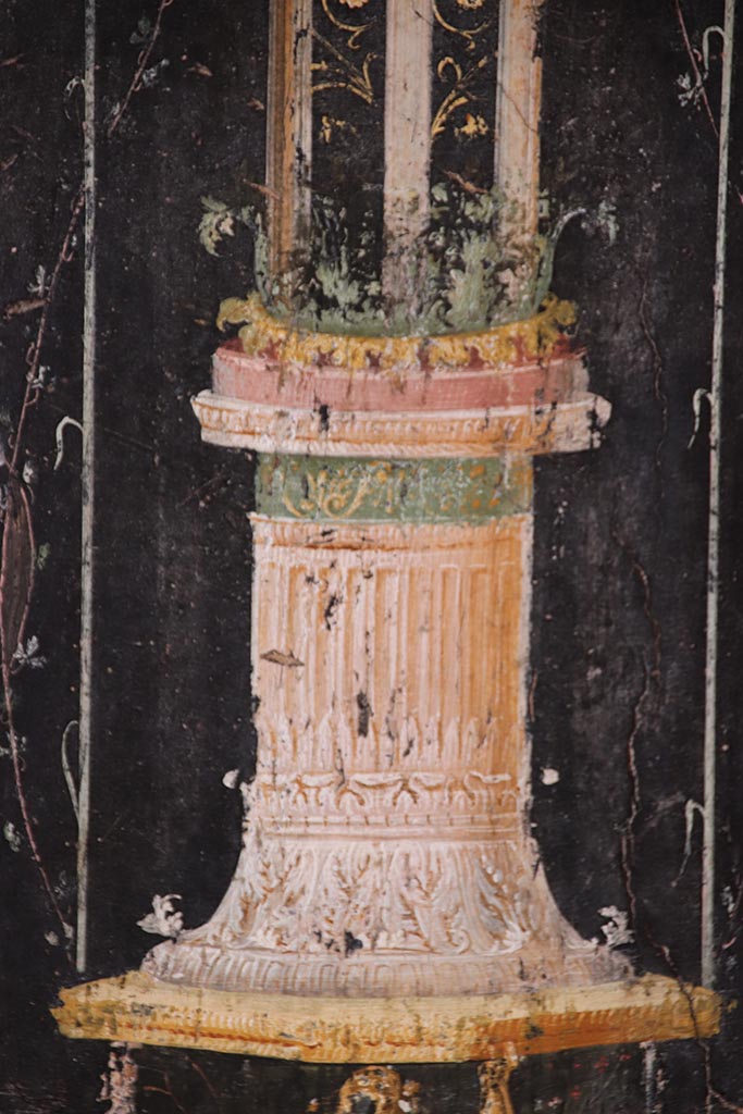 VI.15.1 Pompeii. October 2024.
Detail from base of panel on west wall on south side of panel with Cupid’s buying and selling wine.
Photo courtesy of Klaus Heese.