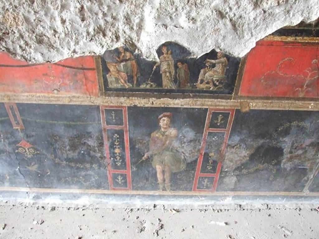 VI.15.1 Pompeii. December 2006. Predella and zoccolo on lower west wall on south side of central panel.
Wall painting showing Orestes and Pylades at Tauris in the presence of King Thoas and of Iphigenia who is now a priestess of Artemis.
Underneath is a standing figure of an Amazon armed with a shield.