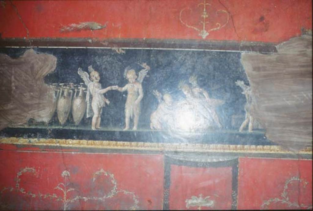 VI.15.1 Pompeii. October 1992. West wall with painting of cupids buying and selling wine.
Photo by Louis Méric courtesy of Jean-Jacques Méric.