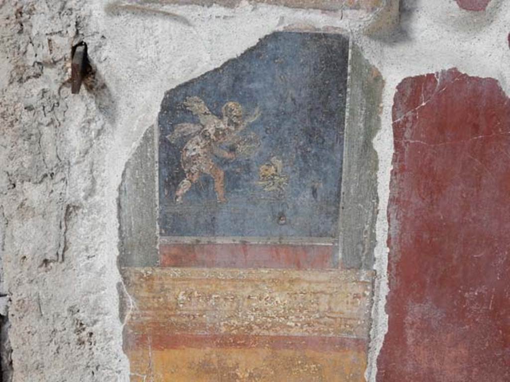 VI.15.1 Pompeii. May 2017. Detail of painted panel on west wall of north ala.. Photo courtesy of Buzz Ferebee.