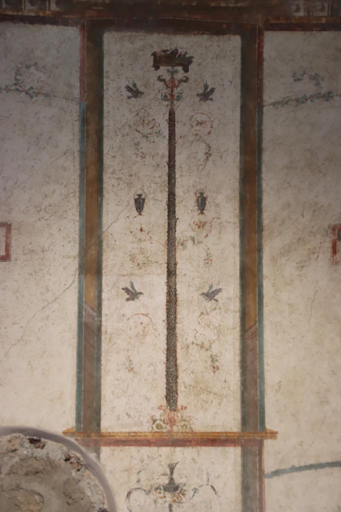 VI.15.1 Pompeii. October 2023.
Central panel with painted candelabra from north wall. Photo courtesy of Klaus Heese.