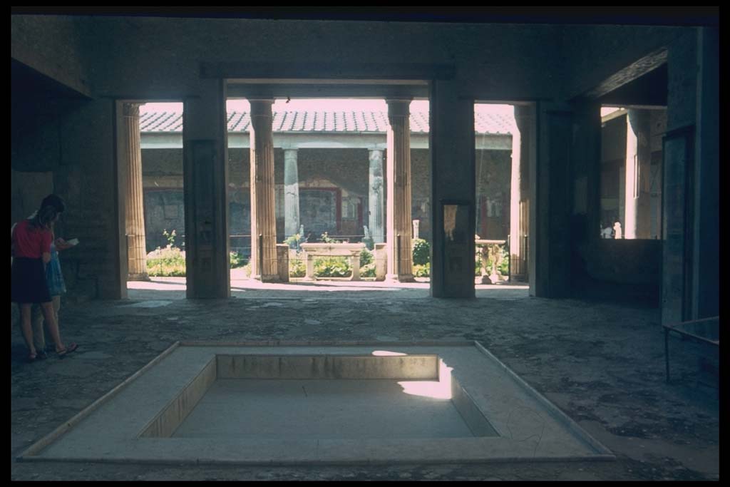 VI.15.1 Pompeii. Looking west across atrium towards peristyle.
Photographed 1970-79 by Günther Einhorn, picture courtesy of his son Ralf Einhorn.