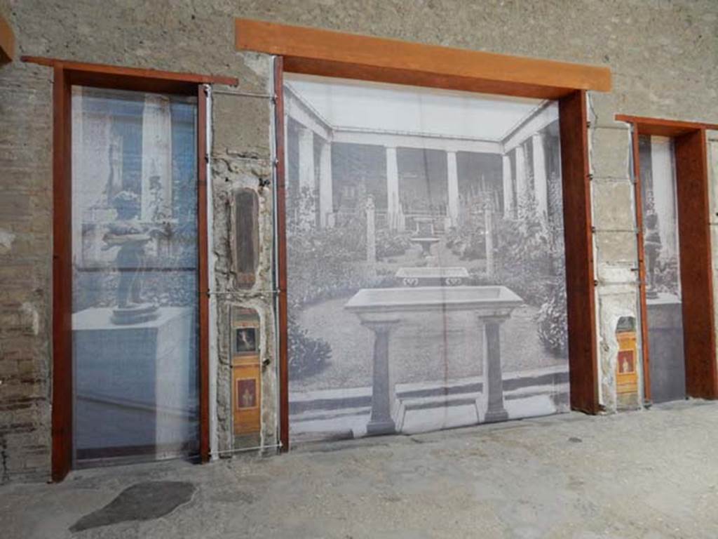 VI.15.1 Pompeii. May 2017.
Looking west towards (temporary) screens shielding peristyle (l) and viridarium (m) from atrium (c). Photo courtesy of Buzz Ferebee.