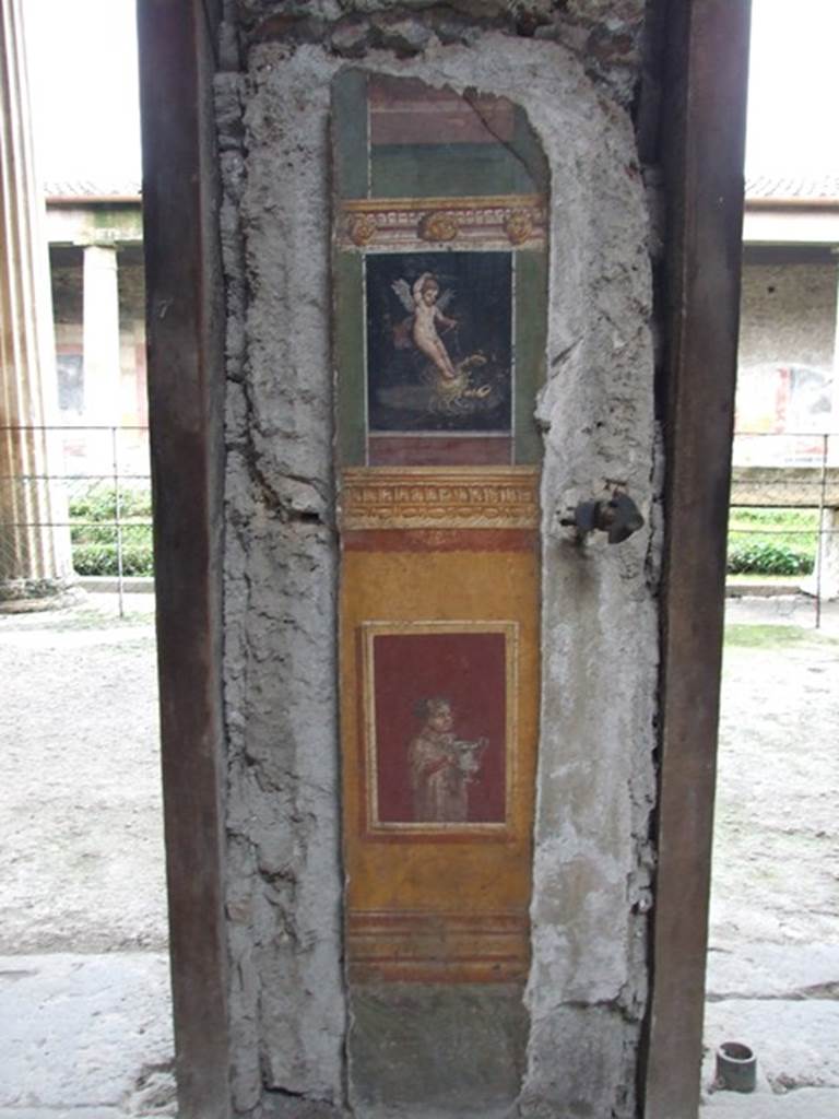 VI.15.1 Pompeii. December 2006. Detail of painted pillar between Peristyle and Atrium.