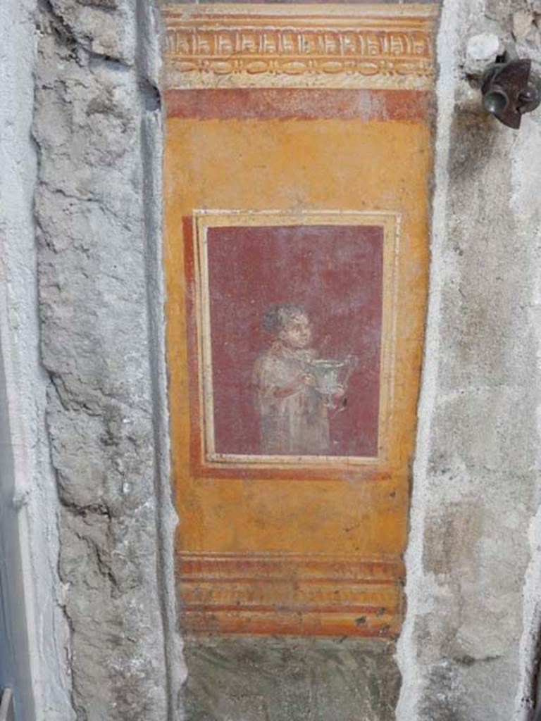 VI.15.1 Pompeii. May 2017.
Detail of painted panel on south end of lower west wall of atrium, leading onto peristyle. Photo courtesy of Buzz Ferebee.