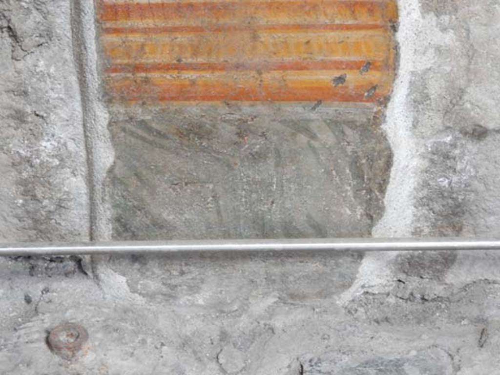 VI.15.1 Pompeii. May 2017.
Detail of painted panel on south end of lower west wall of atrium, leading onto peristyle. Photo courtesy of Buzz Ferebee.