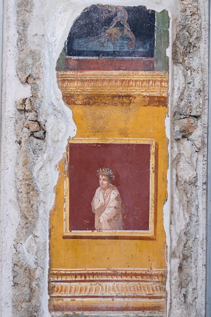 VI.15.1 Pompeii. March 2023.
Painted panel on north end of west wall of atrium, leading onto peristyle. Photo courtesy of Johannes Eber.